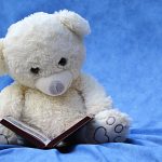 bear stuffie reading book