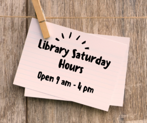 card clothes pinned to a line reading library saturday hours open 9 am - 4 pm
