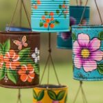 image of diy planters made with tin cans and decorated with painted flowers